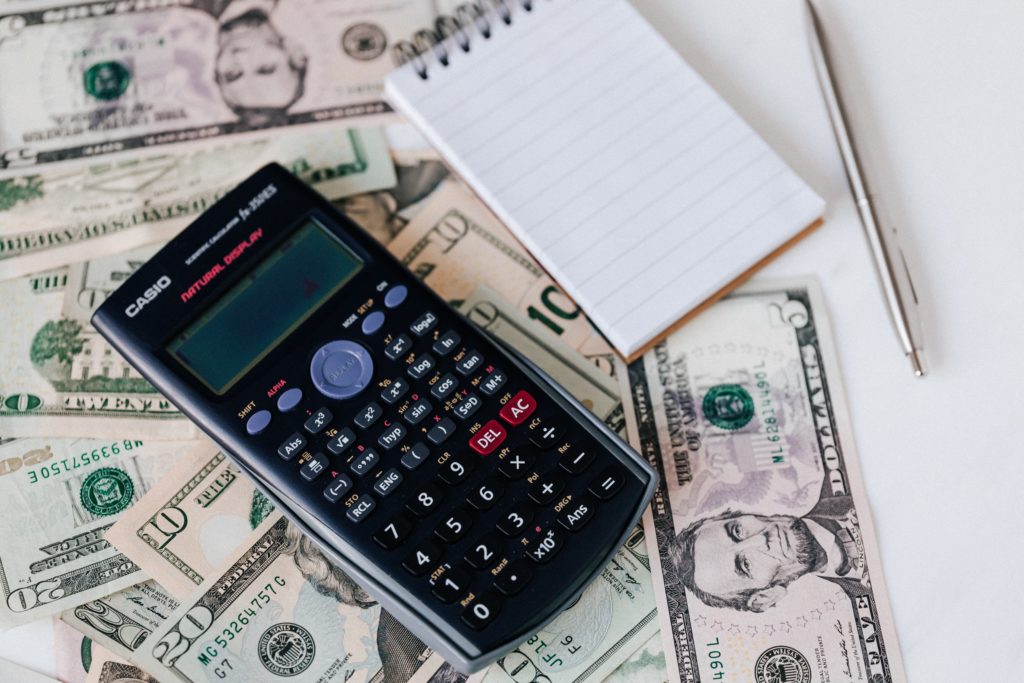 calculator on top of money tax
