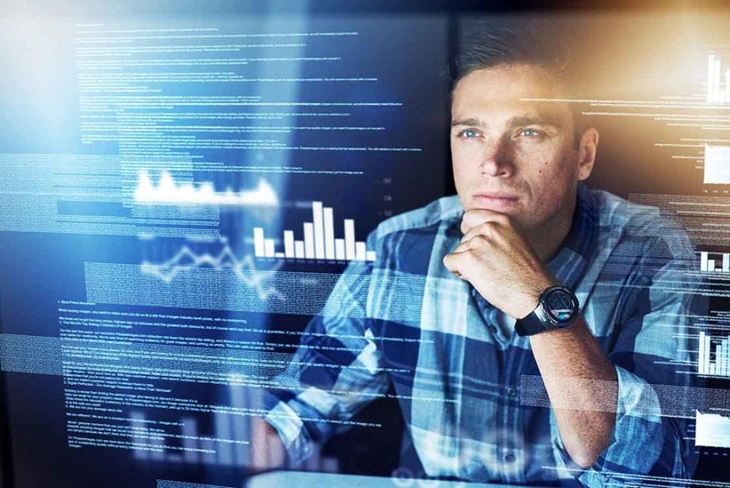 Man looking at data and analytics in a dashboard